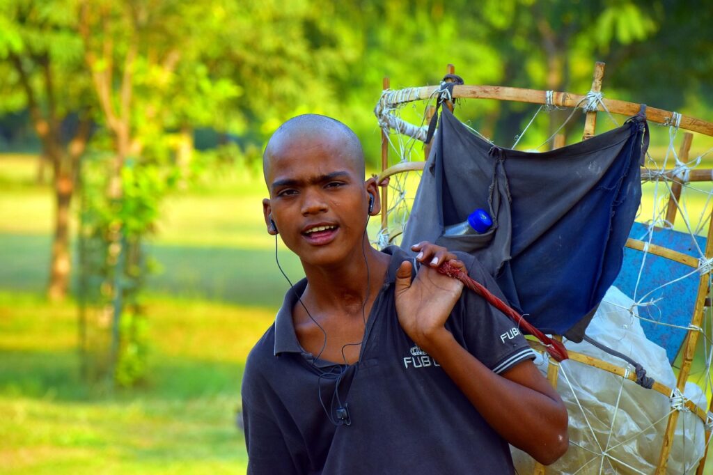 Indian Boy Selling Papads in Local Market