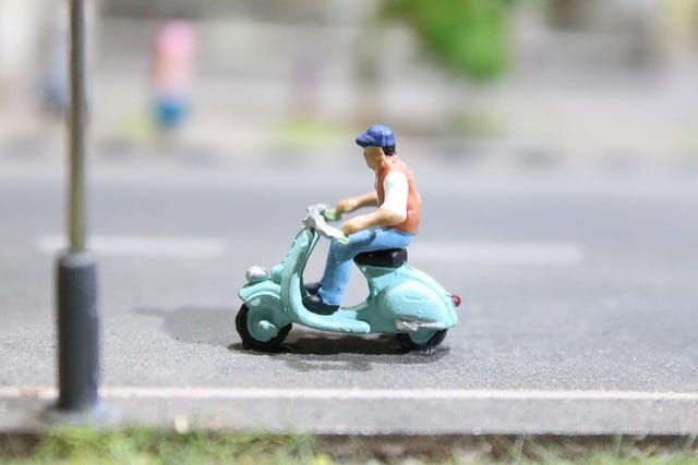 Handmade Man With Scooter Clay Toy